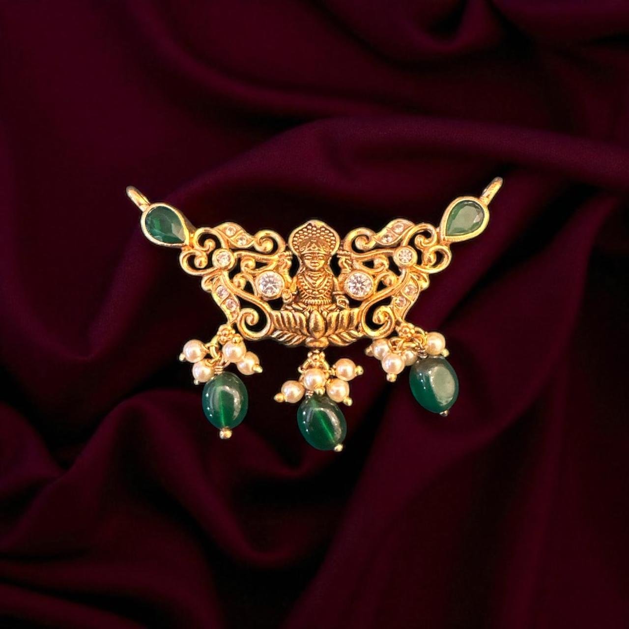 Laxmi devi design pendent with emerald cz stone with gold polish