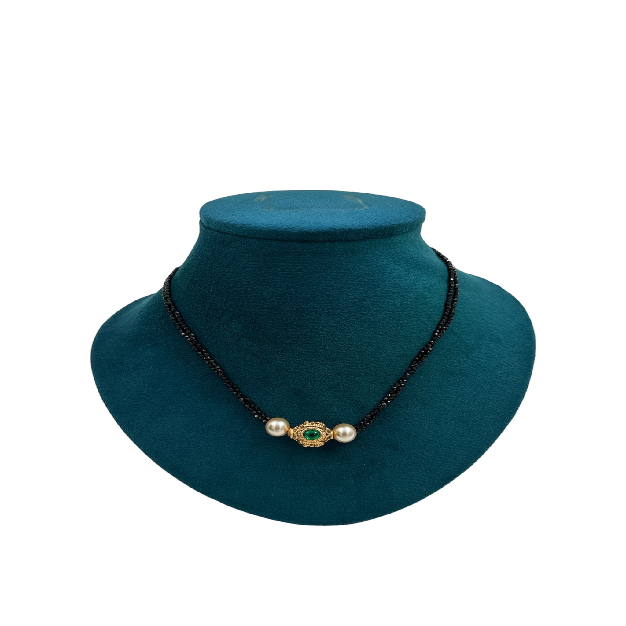 Black crystel chain along with pearl and gold ball