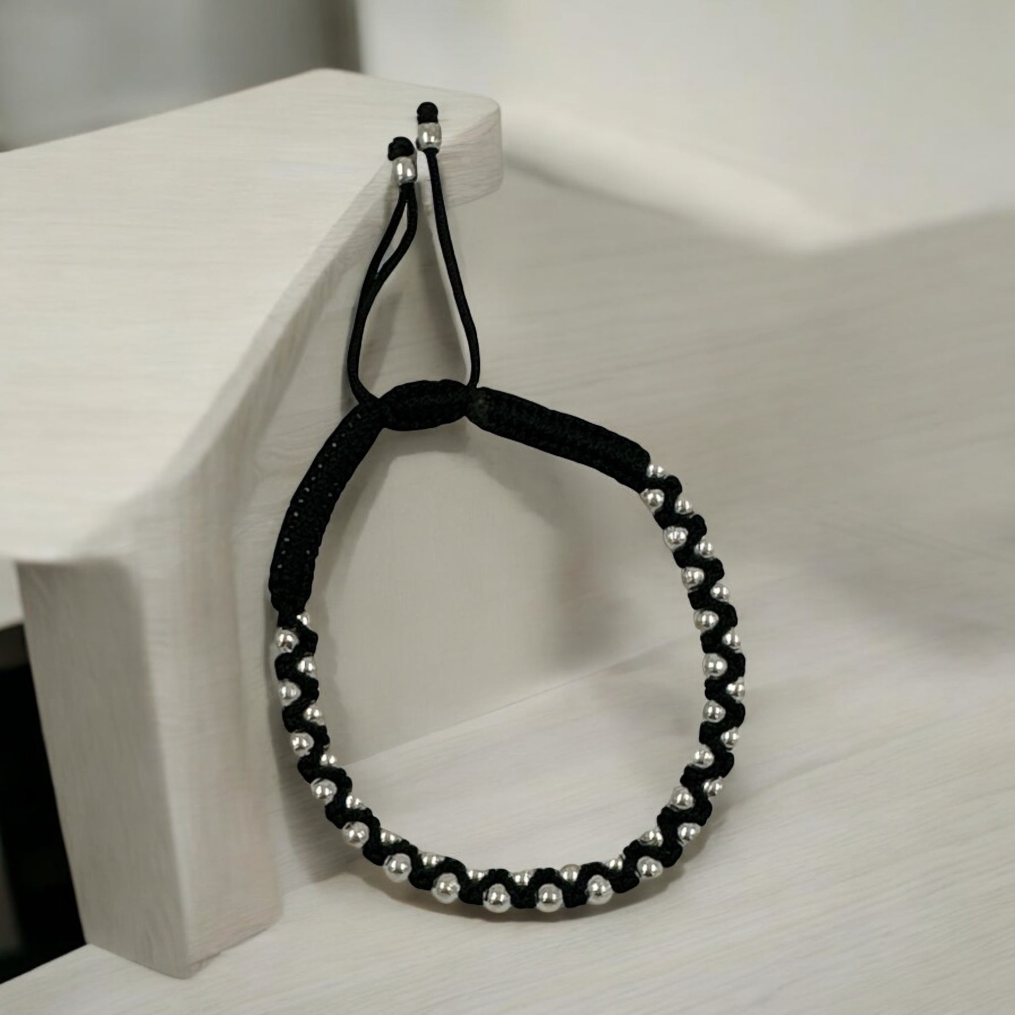 Silver Balls With Black Thread